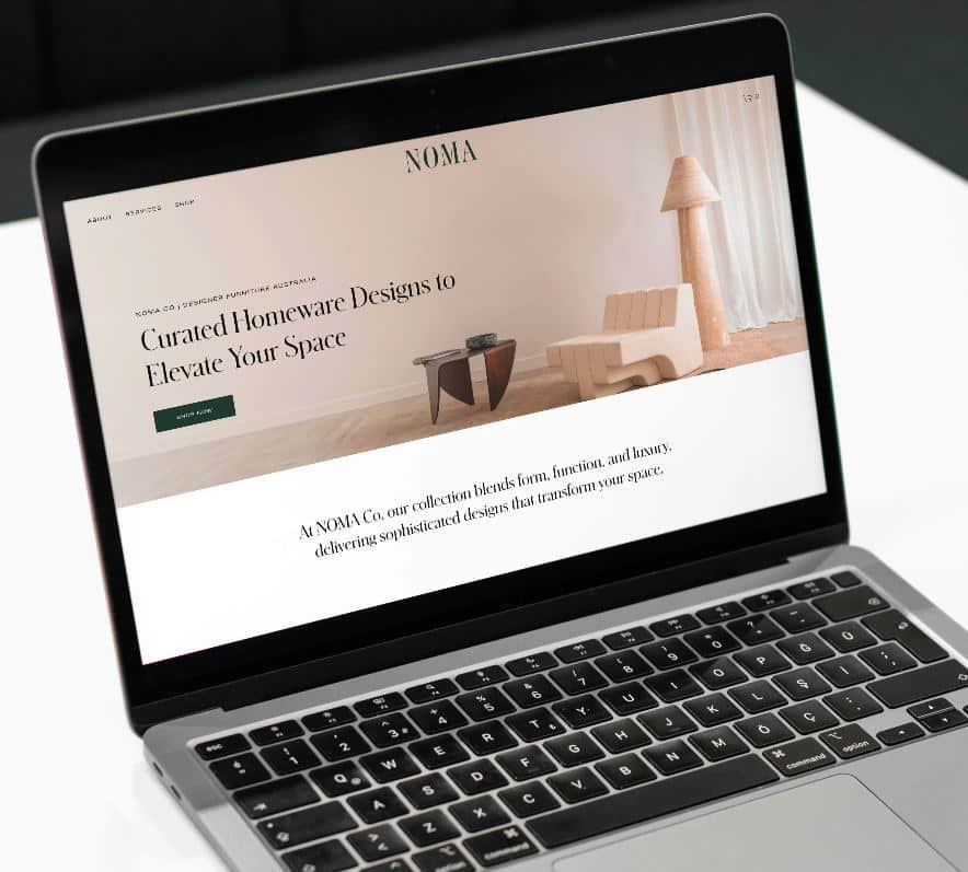 Laptop displaying NOMA homepage for curated homeware designs to elevate interior spaces.