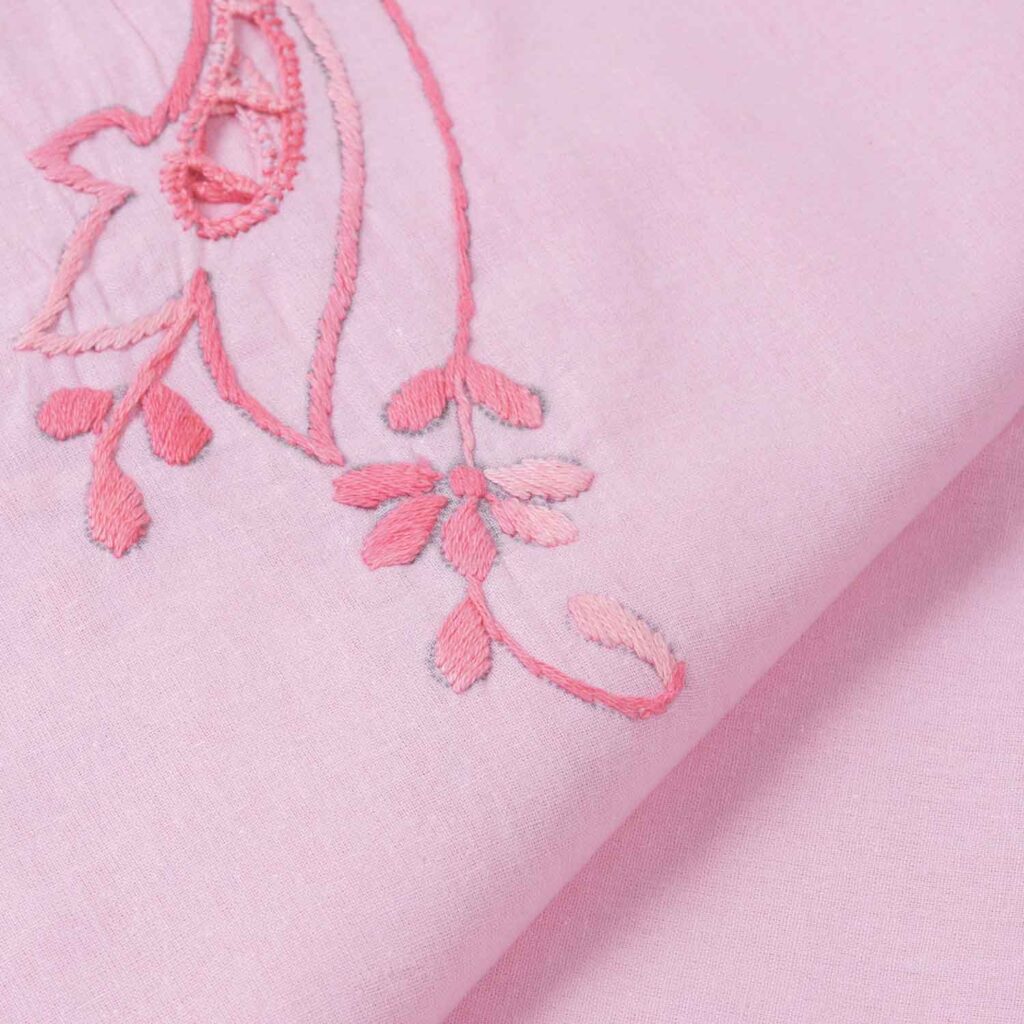 IMG_9549copy Close-up of pink fabric with delicate floral embroidery, highlighting intricate design and soft texture. | Sky Rye Design Close-up of pink fabric with delicate floral embroidery, highlighting intricate design and soft texture.