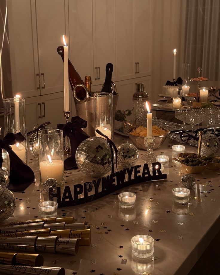 Instagram Festive New Year's Eve table setup with candles, disco balls, confetti, and snacks, creating a celebratory atmosphere. | Sky Rye Design Festive New Year's Eve table setup with candles, disco balls, confetti, and snacks, creating a celebratory atmosphere.