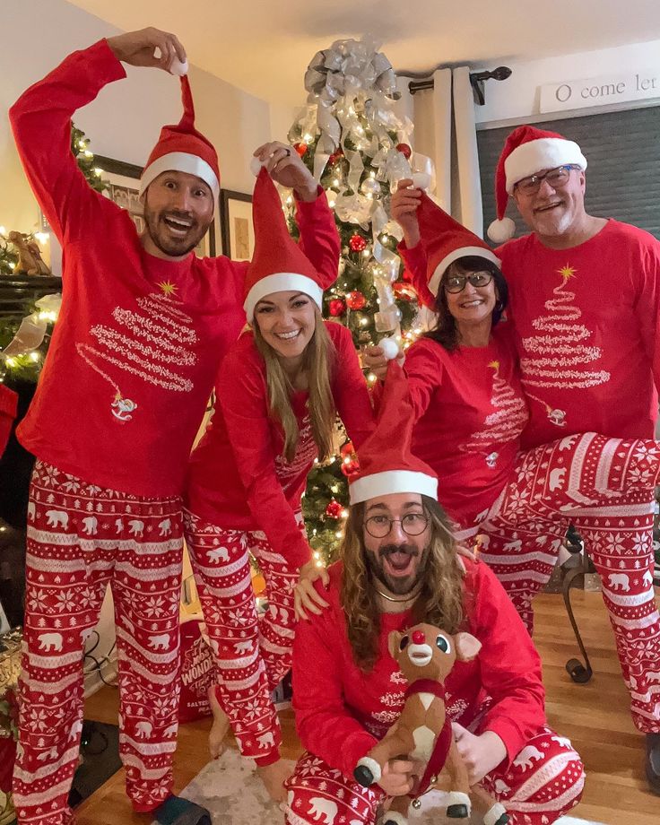 Its that time of yearmatching PJs for the famwait until you see our family reel ☺️ And a look back at some of my favorite matching pj moments_ ❤️ Family in matching festive pajamas and Santa hats celebrating Christmas by a decorated tree. | Sky Rye Design Family in matching festive pajamas and Santa hats celebrating Christmas by a decorated tree.