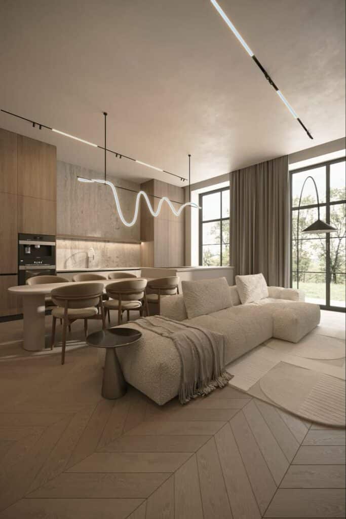 Modern open-plan living room with minimalist furniture and sleek lighting, featuring a cozy sofa and wooden flooring.