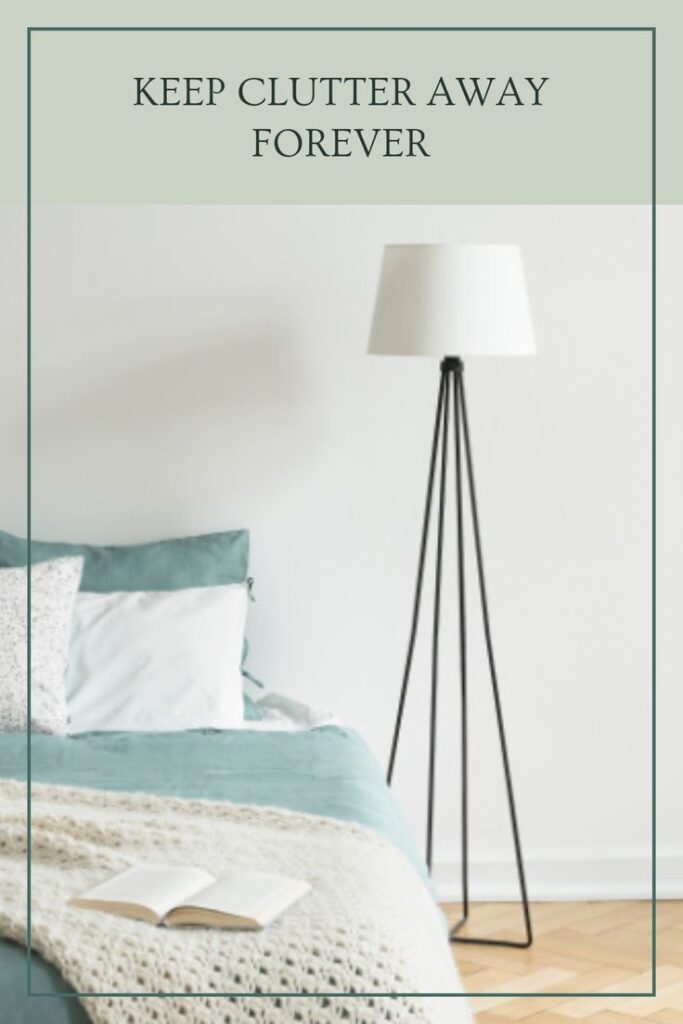 Minimalist bedroom with modern floor lamp and cozy bedding, promoting clutter-free living.