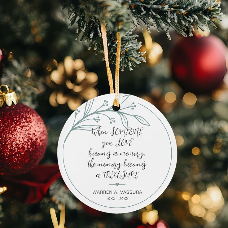 Memorial Christmas ornament on tree, gold and red decorations, heartfelt quote about love and memory.