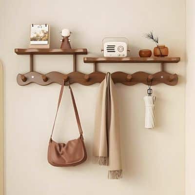 Latitude Run® Wave Wall Hooks For Entryway Bedroom Door No Drill Hanging Organizer Coat Rack Storage Shelf in Brown _ 6_3_ H X Wooden wall shelves with hooks, displaying decor, a brown bag, beige scarf, and umbrella. Modern home organization. | Sky Rye Design Wooden wall shelves with hooks, displaying decor, a brown bag, beige scarf, and umbrella. Modern home organization.