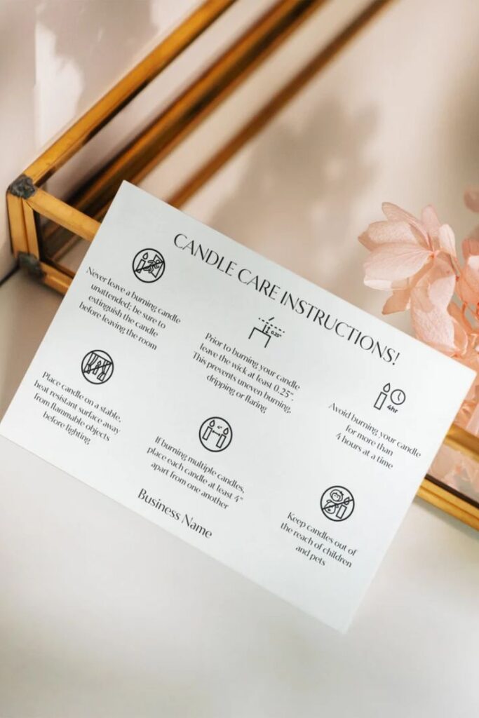 Luxury Candle Care Card Template Modern Candle Care Card Package Insert Card Customer Insert Card Candle care instructions card with safety icons on a decorative surface and pink flowers nearby. | Sky Rye Design Candle care instructions card with safety icons on a decorative surface and pink flowers nearby.