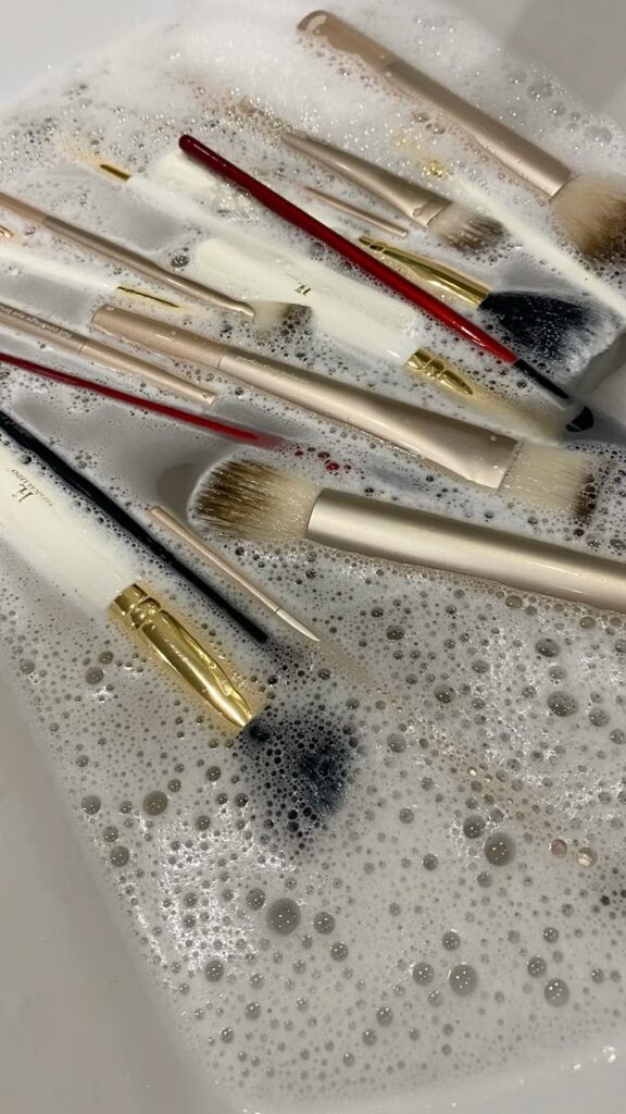 Makeup brushes Makeup brushes soaking in soapy water for a deep cleaning. Beauty tools maintenance and hygiene. | Sky Rye Design Makeup brushes soaking in soapy water for a deep cleaning. Beauty tools maintenance and hygiene.