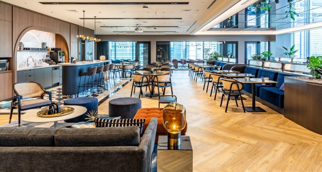 Mask-Group-136_GTS Modern coworking space with stylish furniture, ambient lighting, and a welcoming atmosphere for productivity. | Sky Rye Design Modern coworking space with stylish furniture, ambient lighting, and a welcoming atmosphere for productivity.