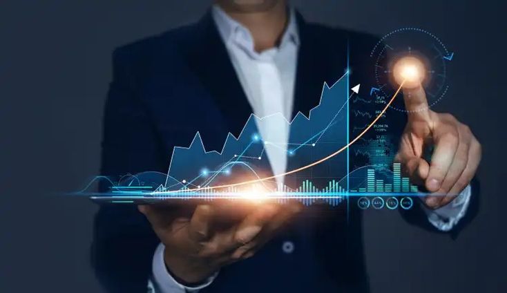 Businessman analyzing digital growth chart on a virtual screen, representing market trends and data analytics.