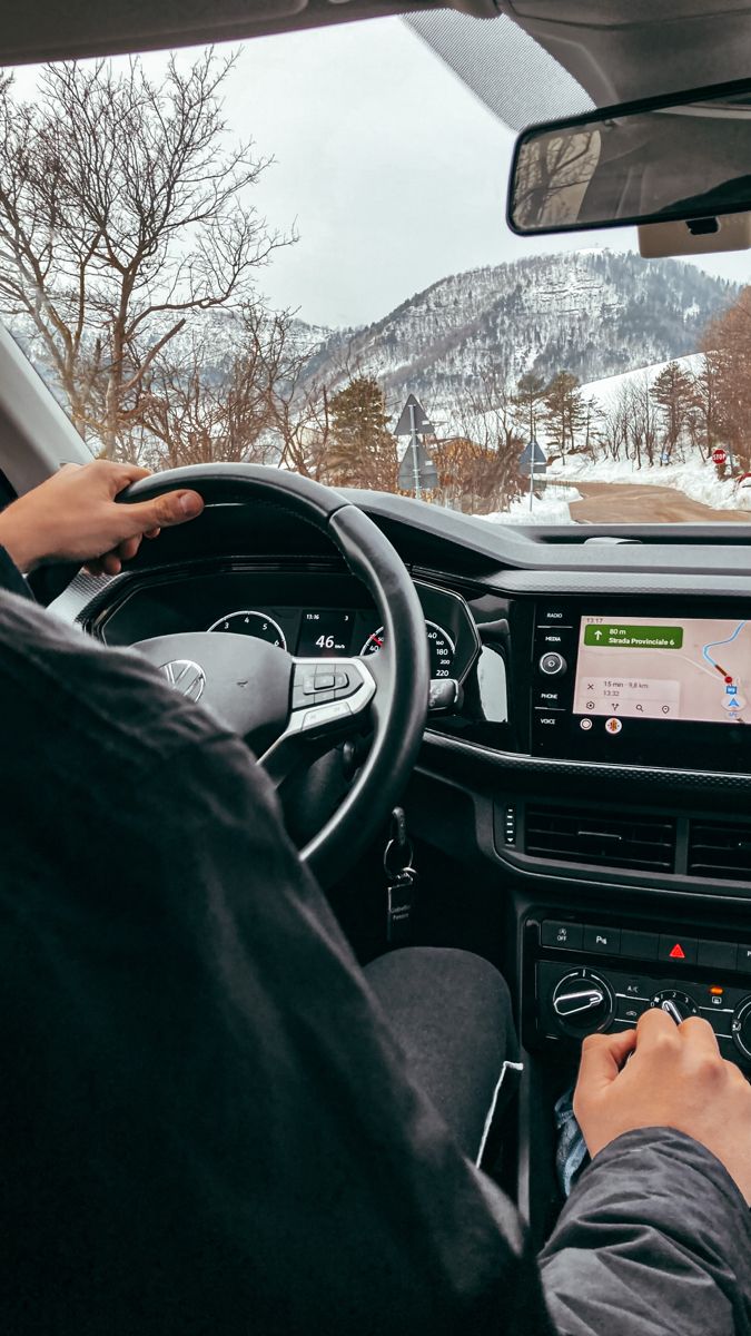 My fav season ❄️ Driving through snowy mountains, hands on steering wheel, GPS navigation screen showing route. | Sky Rye Design Driving through snowy mountains, hands on steering wheel, GPS navigation screen showing route.