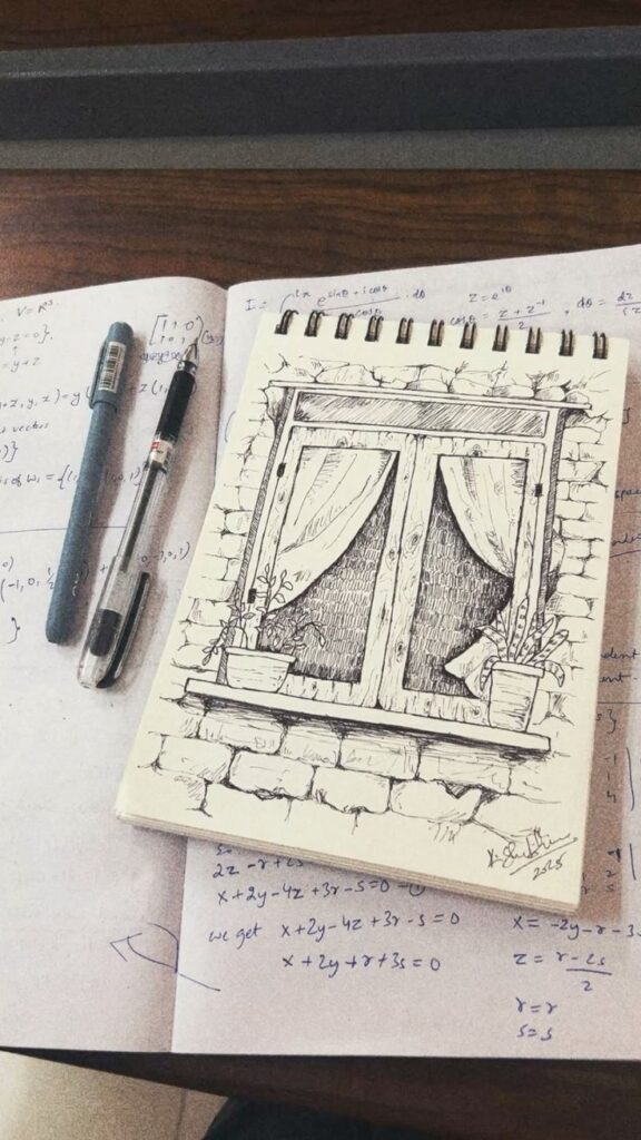 Pen sketch Sketch of a window scene on a notepad, with pens and mathematical notes in the background on a wooden desk. | Sky Rye Design Sketch of a window scene on a notepad, with pens and mathematical notes in the background on a wooden desk.