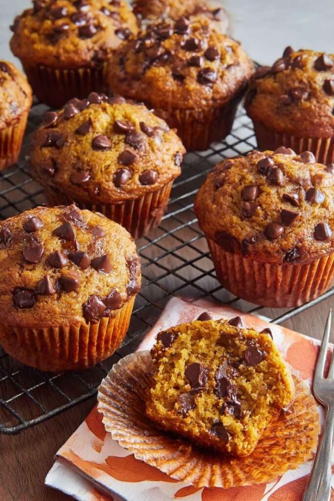 Pioneer Woman Pumpkin Chocolate Chip Muffins Recipe - Delish Sides Freshly baked chocolate chip muffins cooling on a rack, one cut open to reveal melty chocolate chips inside. | Sky Rye Design Freshly baked chocolate chip muffins cooling on a rack, one cut open to reveal melty chocolate chips inside.