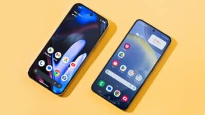 Two smartphones on a yellow background displaying home screens with various app icons, showcasing modern mobile interfaces.