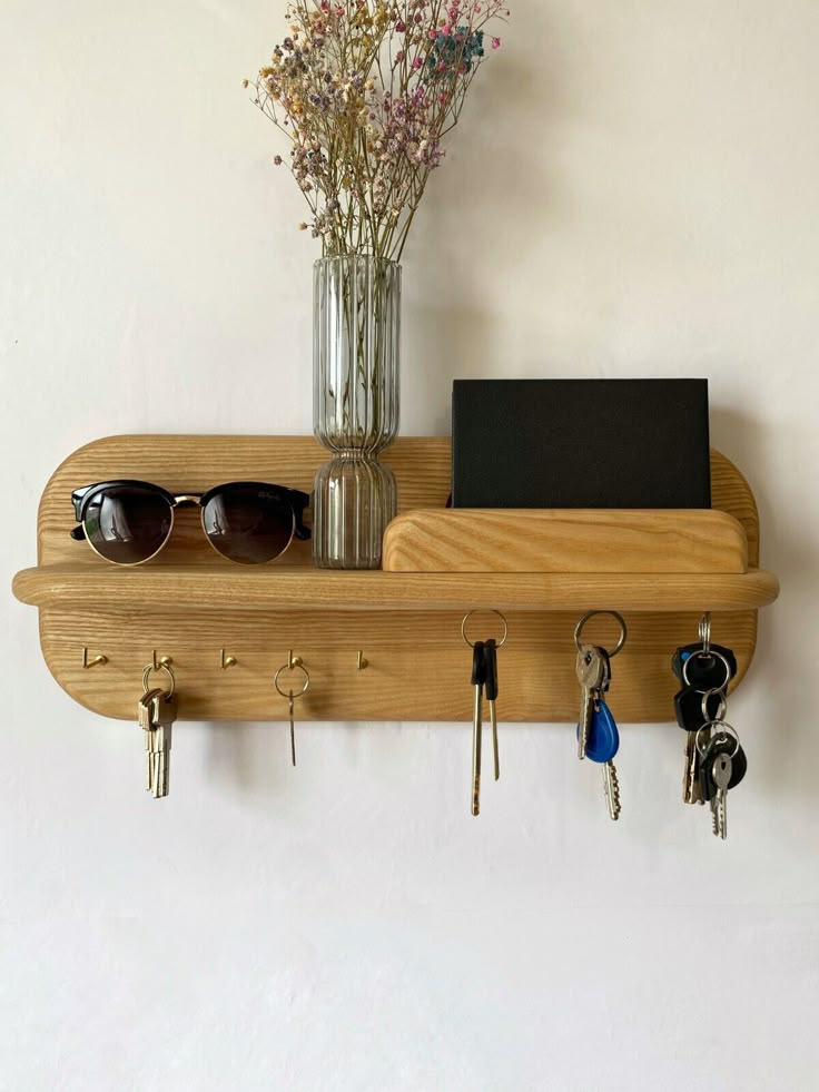 Shelf Key Holder Wall Wooden Wall Mounted Key Shelfentryway Shelf Hooks_magnet Wooden wall shelf with keys, sunglasses, and flowers in a vase, ideal for organizing entryway essentials. | Sky Rye Design Wooden wall shelf with keys, sunglasses, and flowers in a vase, ideal for organizing entryway essentials.