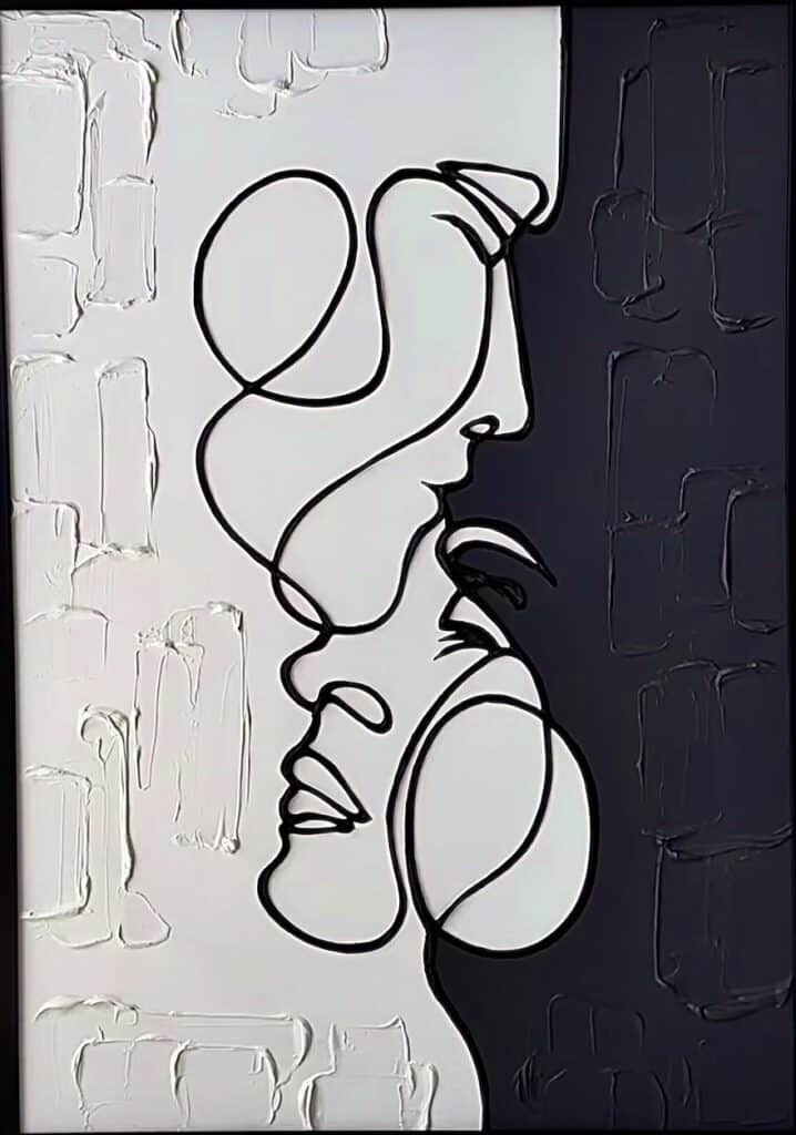 Abstract line drawing of two faces in black and white, symbolizing connection and duality.