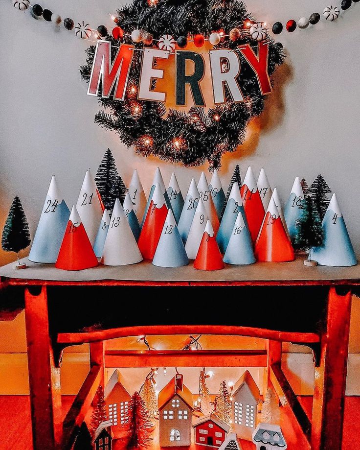 The Wishing Elephant on Instagram_ Its advent calendar time Head to the blog to check out how to make this amazing mountain themed advent calendar_ This DIY has an easy Christmas countdown display with numbered cone trees and festive decor under a Merry sign. | Sky Rye Design Christmas countdown display with numbered cone trees and festive decor under a Merry sign.