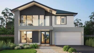 Modern two-story house with large windows, a stone driveway, and landscaped front yard, set against a clear sky backdrop.
