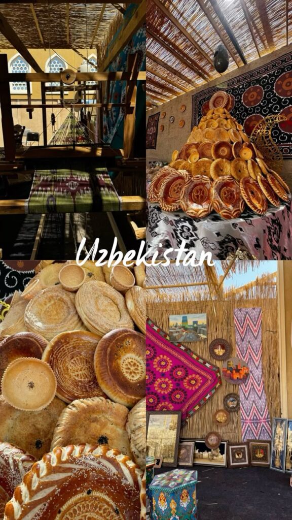 Uzbekistan Uzbekistan cultural display with traditional bread, rugs, and crafts in a colorful market setting. | Sky Rye Design Uzbekistan cultural display with traditional bread, rugs, and crafts in a colorful market setting.