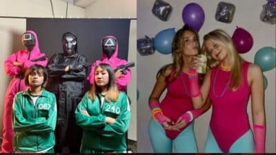 Group dressed in Squid Game and retro workout costumes for a themed party with balloons and props.