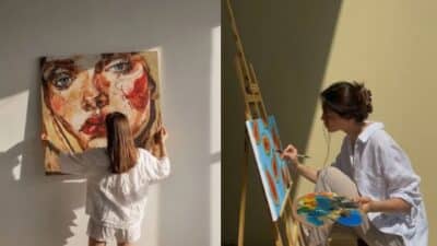 Artist creating vibrant portraits on canvas in sunny studio setting.