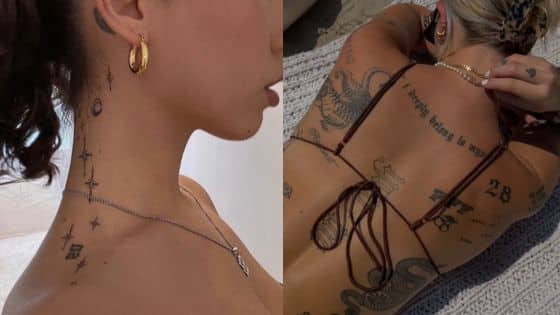 Viewing Deck Blog - 2025-10-21T212543336 Person showcasing intricate neck and back tattoos in a stylish pose, wearing gold accessories and a bikini top. | Sky Rye Design Person showcasing intricate neck and back tattoos in a stylish pose, wearing gold accessories and a bikini top.