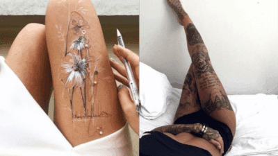 Floral and script tattoos on legs, showcasing intricate black and white designs. Artful and detailed body ink.