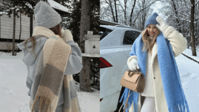Woman in winter attire with cozy scarves and beanies, standing outdoors in snow. Fashionable winter look.