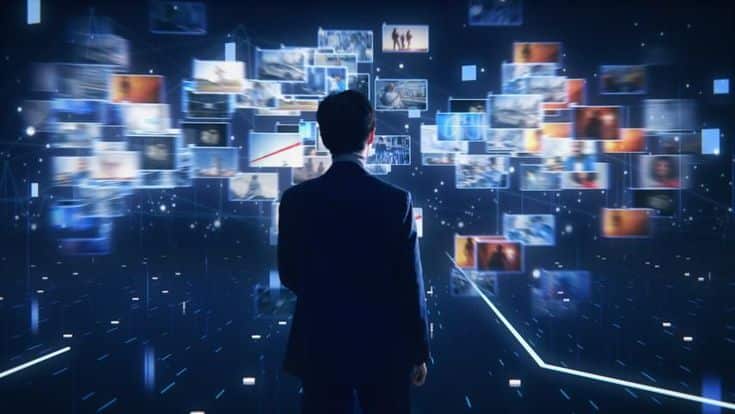 Person in suit viewing virtual screens in futuristic digital landscape.