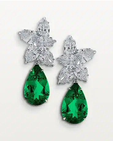 Vivid4 Elegant earrings with diamond floral design and teardrop emeralds. Perfect for luxury fashion or special occasions. | Sky Rye Design Elegant earrings with diamond floral design and teardrop emeralds. Perfect for luxury fashion or special occasions.