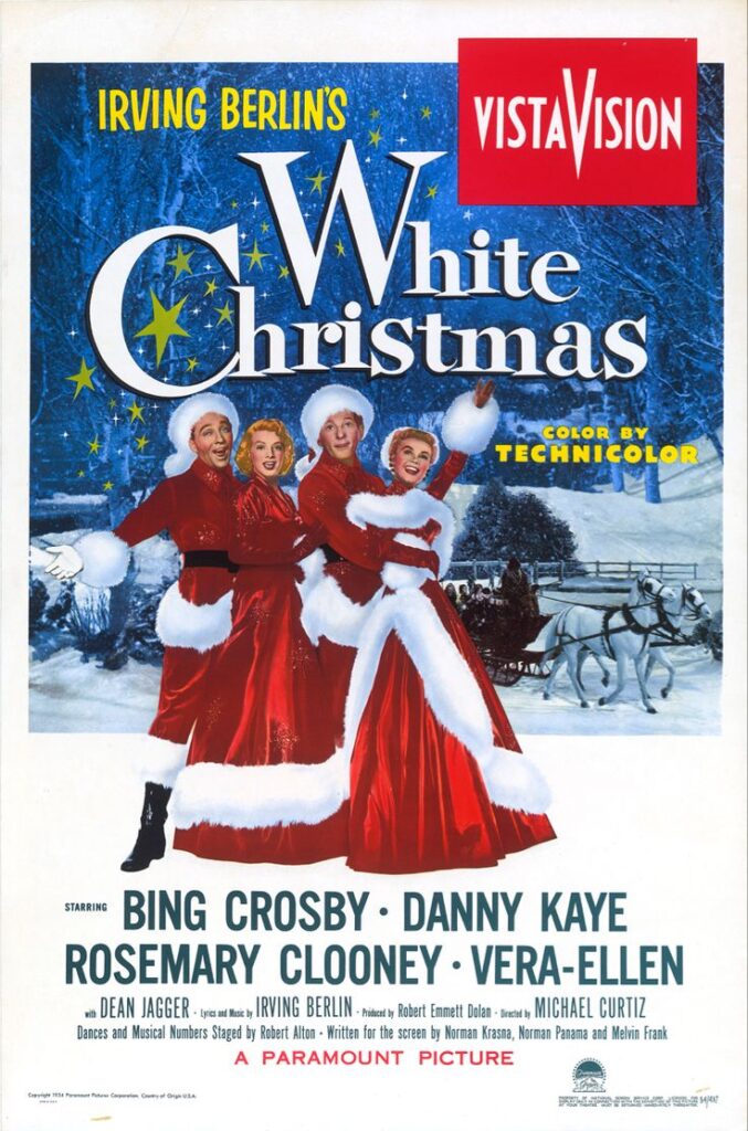 White Christmas movie poster featuring cast in festive attire with snowy, starry backdrop.