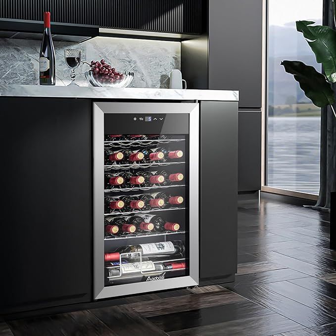 Wine Fridge Beverage Wine Refrigerator Glass DoorMini Wine Cellar Aging Red_White_Champagne_Spark Modern kitchen with a sleek wine cooler filled with bottles, next to marble counter and a glass of red wine. | Sky Rye Design Modern kitchen with a sleek wine cooler filled with bottles, next to marble counter and a glass of red wine.