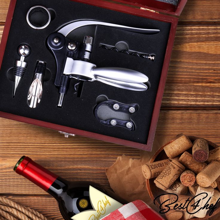 Wine Opener Set with Wine Stoppers Drip Ring Foil Cutter and Extra Corkscrew Premium 6-Piece Gift Set in Elegant Cherry Wood Case Wine accessory set with corkscrew, stopper, and wine bottle, on a wooden table with corks and red checkered cloth. | Sky Rye Design Wine accessory set with corkscrew, stopper, and wine bottle, on a wooden table with corks and red checkered cloth.