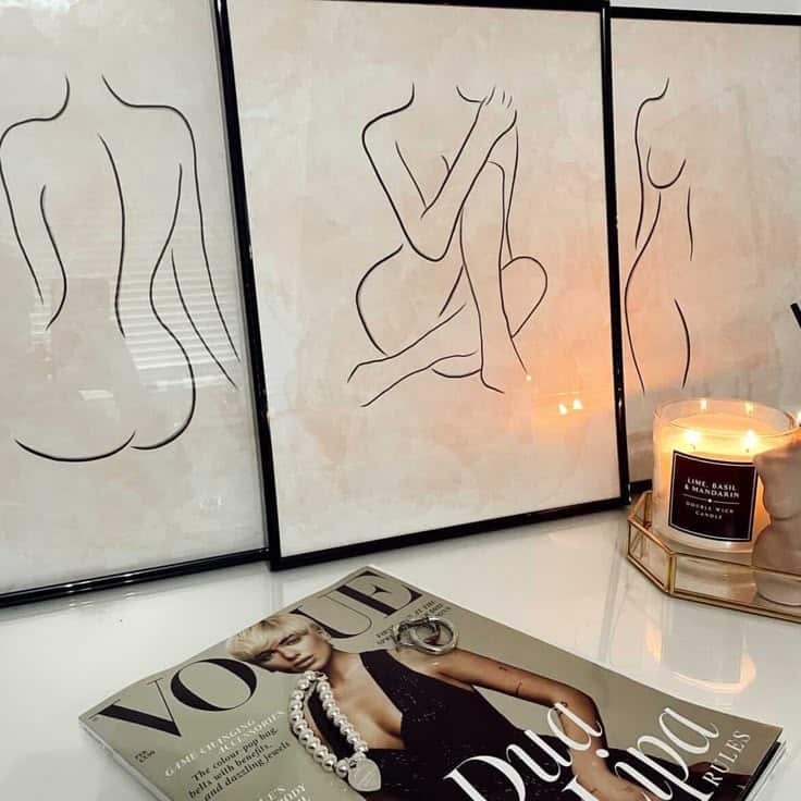 Woman Line Art _ Body Line Drawing _ Naked Woman Drawing _ Minimal Art Minimalist line art with a lit candle and fashion magazine on a white table, creating a stylish decor scene. | Sky Rye Design Minimalist line art with a lit candle and fashion magazine on a white table, creating a stylish decor scene.