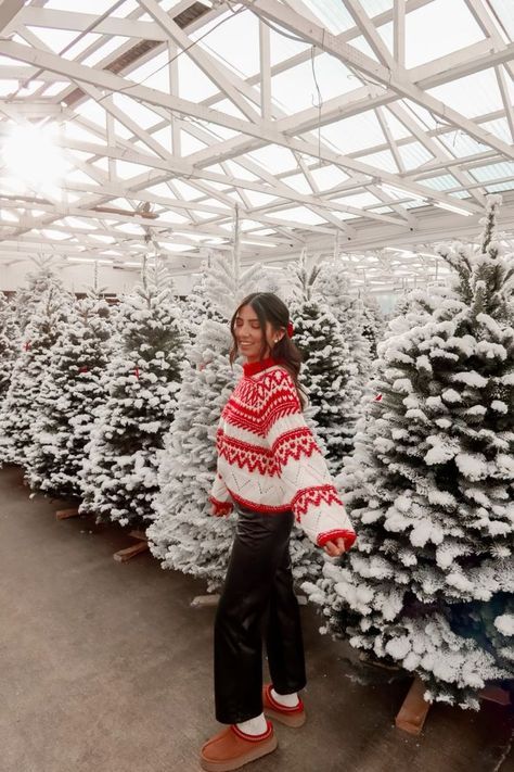 Woman Taken Aback Brothers Roommate Interferance In Her Christmas Plans With Their Family Wo in 2024 _ Christmas outfit Christmas sweater outfits Cozy christmas outfit Woman in red and white sweater stands among snow-dusted Christmas trees in a greenhouse setting. | Sky Rye Design Woman in red and white sweater stands among snow-dusted Christmas trees in a greenhouse setting.