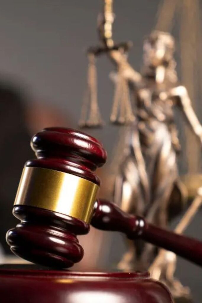 Workplace Justice Expert Employment Law Attorneys Here To Help Gavel resting in front of Lady Justice statue, symbolizing law and fairness in the courtroom. | Sky Rye Design Gavel resting in front of Lady Justice statue, symbolizing law and fairness in the courtroom.