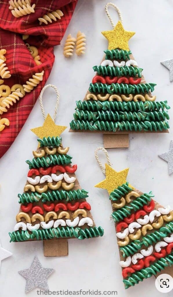 Colorful DIY pasta Christmas tree ornaments with star toppers on a festive background.