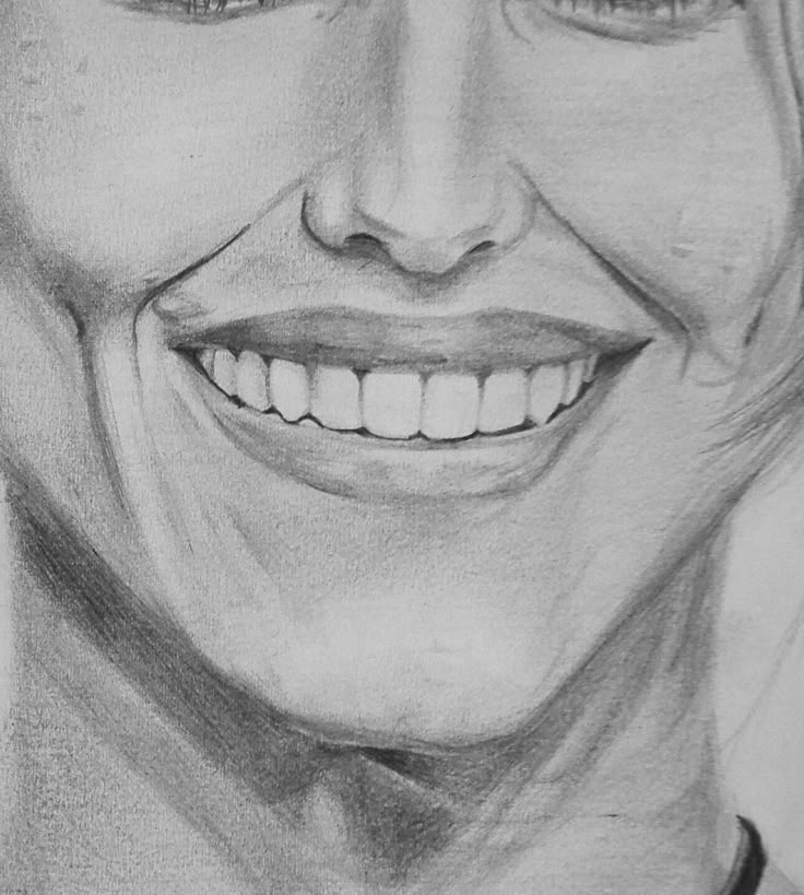 Pencil sketch of a smiling person's face showing teeth, with fine shading detail highlighting dimples and expression.