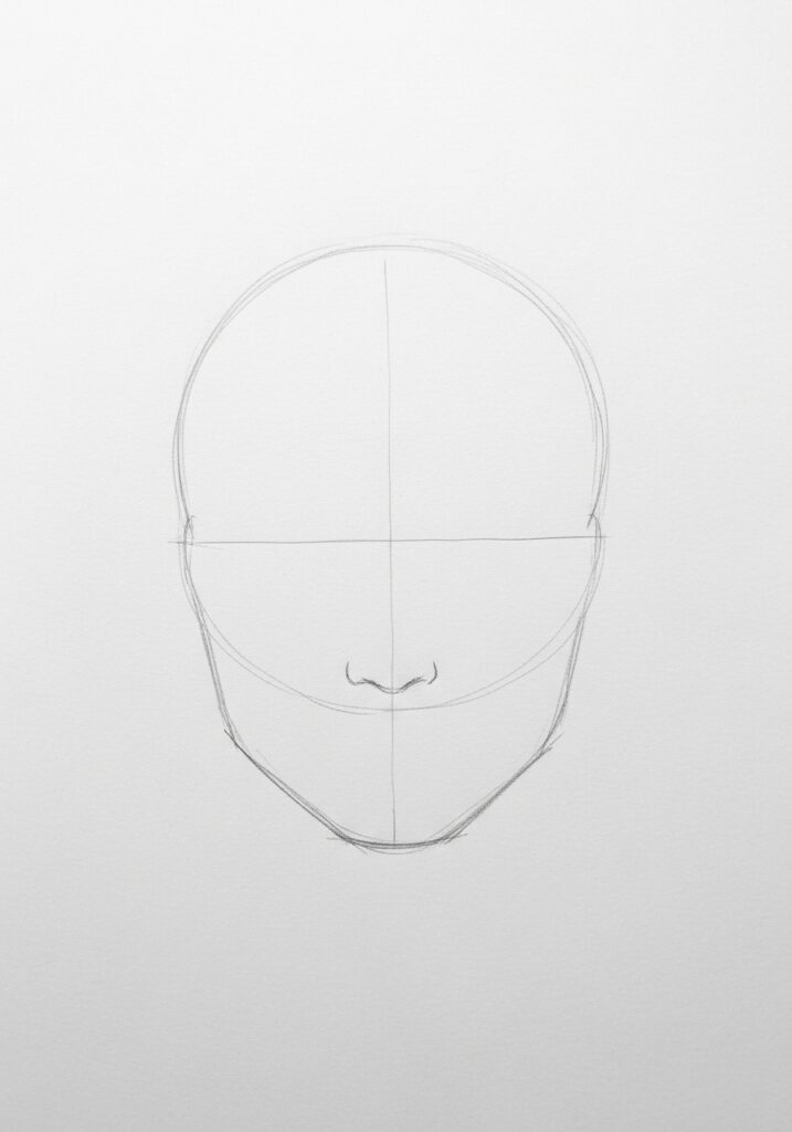 Pencil sketch of a human face outline with guidelines on paper, showing basic proportions and nose detail.