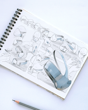 artofindustrialdesign_meta Sketchbook with virtual reality headset designs, featuring concept drawings and a 3D model, beside a pencil. | Sky Rye Design Sketchbook with virtual reality headset designs, featuring concept drawings and a 3D model, beside a pencil.
