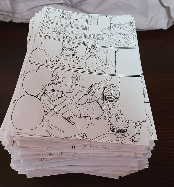 Stack of manga storyboard pages with sketches of action-packed scenes, featuring dynamic characters and speech bubbles.