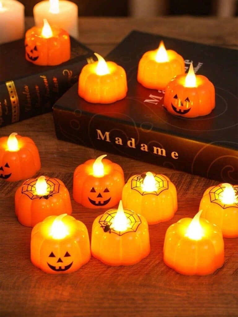 c0f014578dd1f2cc3de9054771cf9485 LED pumpkin candles with Halloween faces light up atop books for festive autumn decor ambiance. | Sky Rye Design LED pumpkin candles with Halloween faces light up atop books for festive autumn decor ambiance.