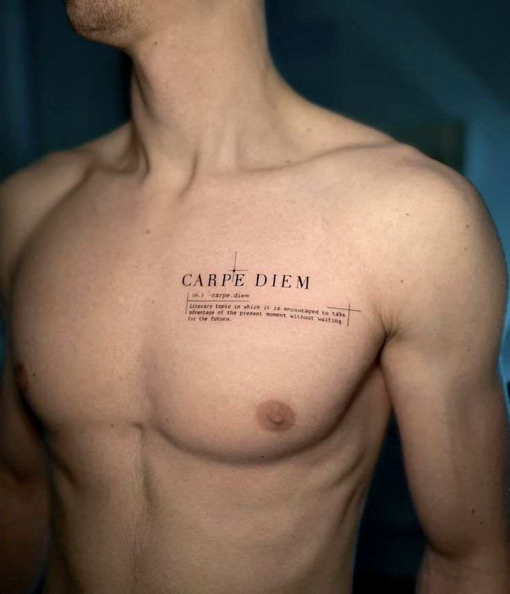 cbb8b42313c90ef29c4021c591d0255a 1 Chest tattoo reading Carpe Diem, emphasizing seizing the day. Crisp, detailed design on a man's upper body. | Sky Rye Design Chest tattoo reading Carpe Diem, emphasizing seizing the day. Crisp, detailed design on a man's upper body.