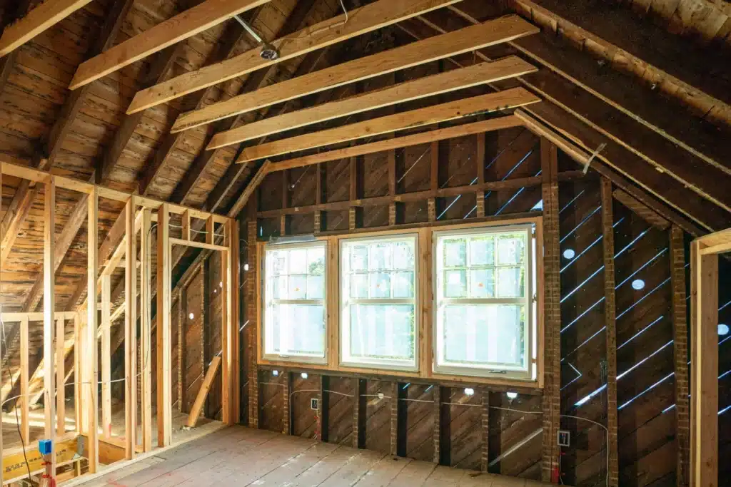 collar-ties_GlenRidge_10122023ZD_0040-scaled Unfinished attic renovation with exposed wood framing and large windows. | Sky Rye Design Unfinished attic renovation with exposed wood framing and large windows.