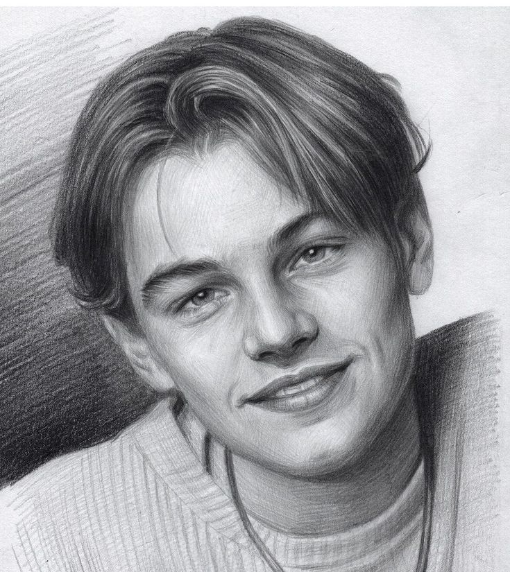 Pencil sketch of a young man with parted hair, smiling, wearing a sweater and necklace. Detailed portrait drawing.