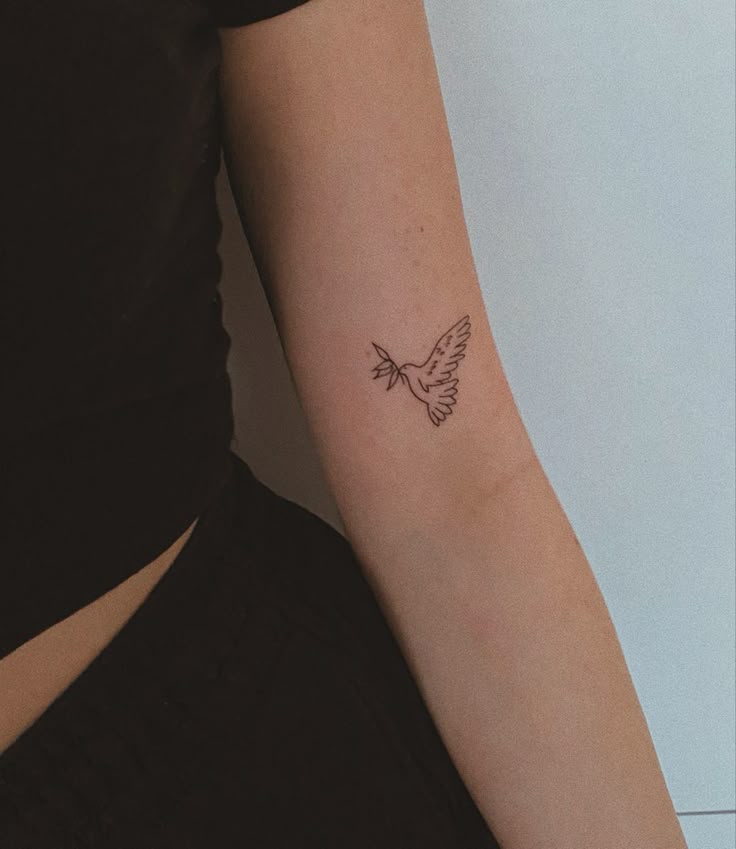 dove tattoo Minimalist dove tattoo on inner arm, symbolizing peace and freedom. | Sky Rye Design Minimalist dove tattoo on inner arm, symbolizing peace and freedom.