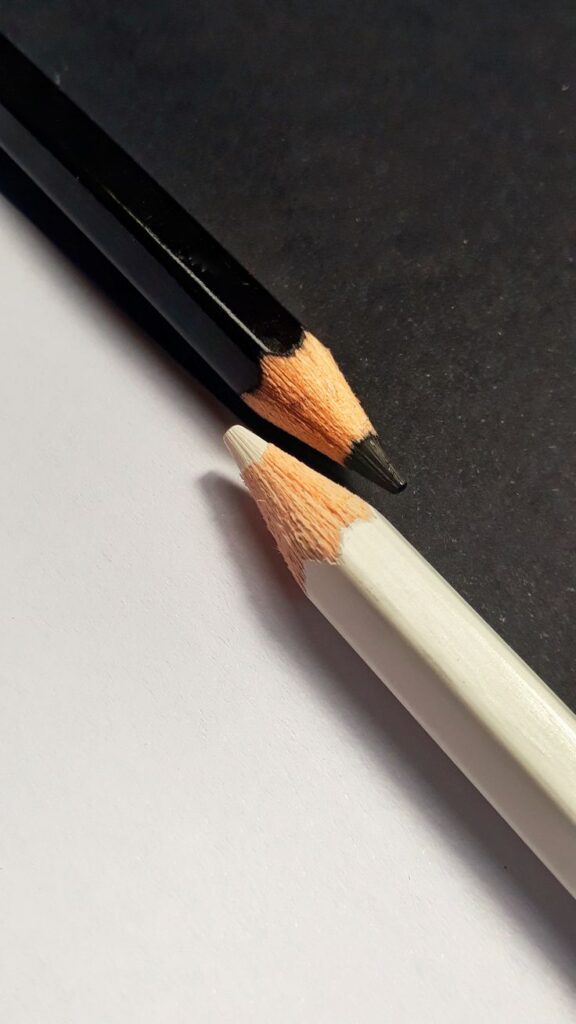 eca6daad-cb58-4d20-9740-44ef15c59c43 Black and white pencils on contrasting background, showcasing minimalistic art concepts. | Sky Rye Design Black and white pencils on contrasting background, showcasing minimalistic art concepts.