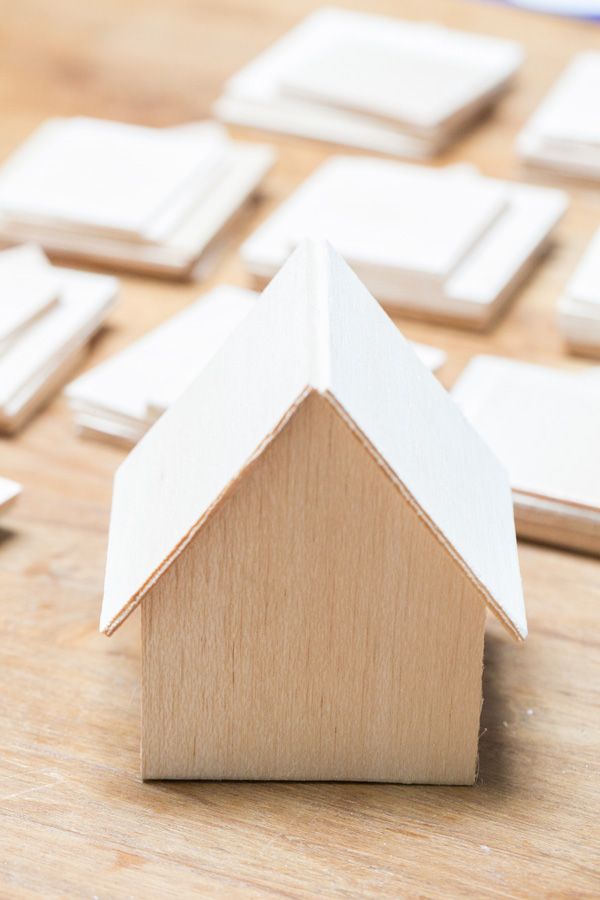 fe32ec514749bddfee56cdc15a9327cb Mini wooden house model surrounded by flat wooden pieces on a wooden table. Perfect for crafts or decoration projects. | Sky Rye Design Mini wooden house model surrounded by flat wooden pieces on a wooden table. Perfect for crafts or decoration projects.