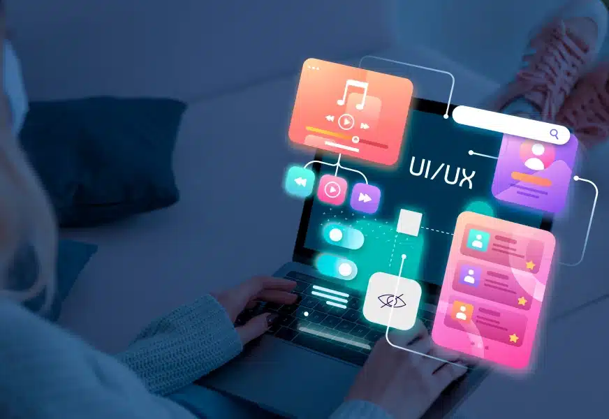 figma_ui_ux_1 Person using laptop with UI/UX design interface overlays, highlighting interactive app features. | Sky Rye Design Person using laptop with UI/UX design interface overlays, highlighting interactive app features.