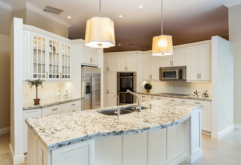 image Modern kitchen with marble countertop, stainless steel appliances, and pendant lighting. Elegant and stylish design. | Sky Rye Design Modern kitchen with marble countertop, stainless steel appliances, and pendant lighting. Elegant and stylish design.