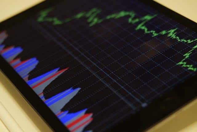 image Tablet displaying colorful financial graphs and bar charts, representing market data and trends analysis. | Sky Rye Design Tablet displaying colorful financial graphs and bar charts, representing market data and trends analysis.