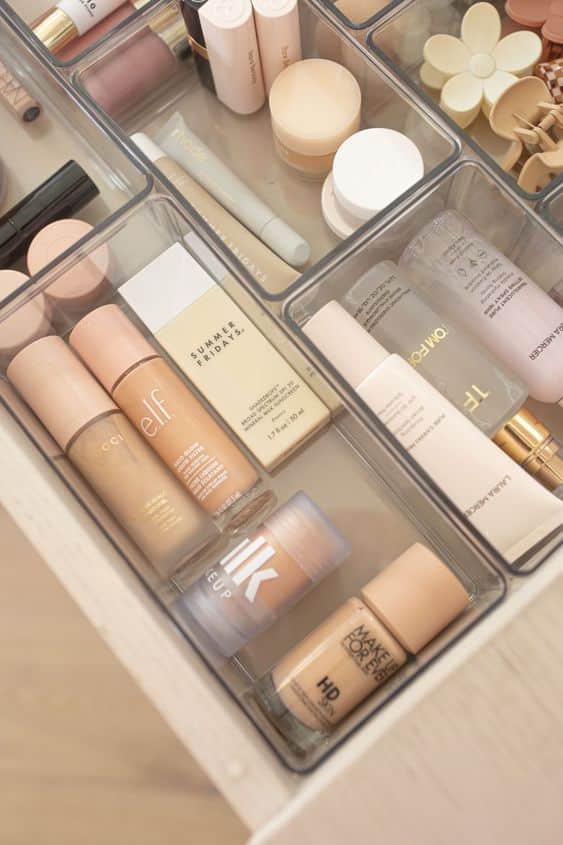 islafranciis on ig Organized makeup collection with foundation, concealer, and skincare products in clear storage drawers. | Sky Rye Design Organized makeup collection with foundation, concealer, and skincare products in clear storage drawers.